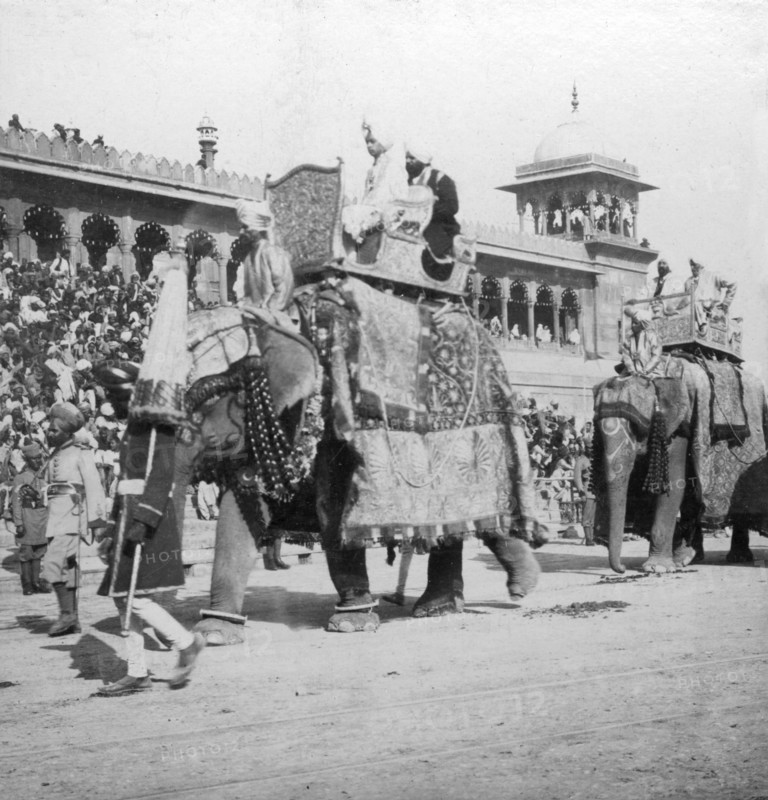 An elephant procession passing Jumma Masjid, Delhi, India, 1900s.Artist: H Hands & Son