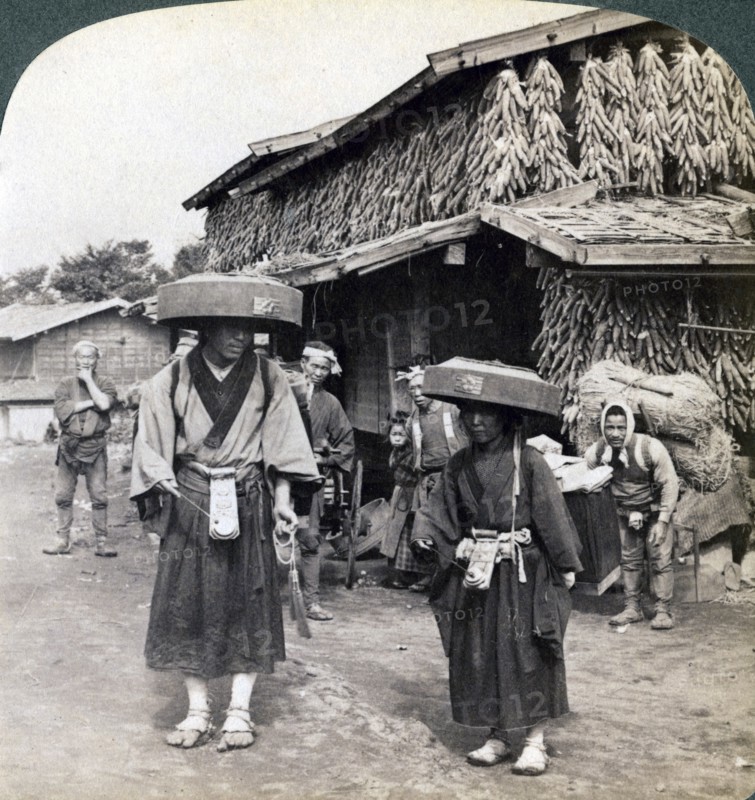 Pilgrim beggars beating little gongs, near Lake Kawaguchi, Japan, 1904. Artist: Underwood & Underwood