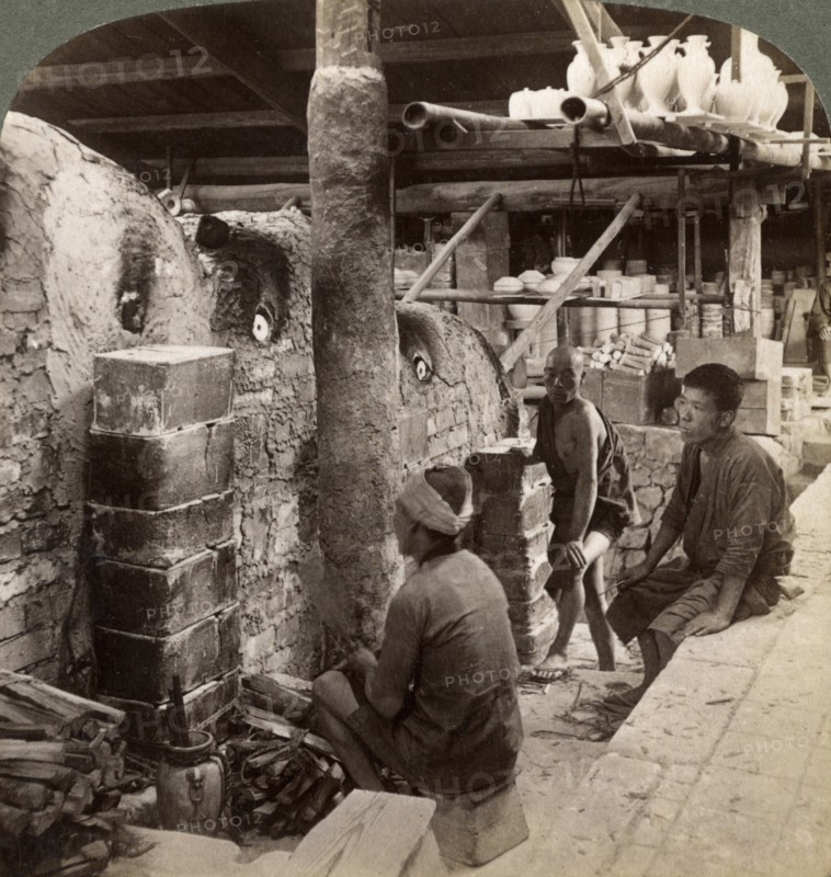 Workmen watching kilns full of Awata porcelain, Kinkosan works, Kyoto, Japan, 1904. Artist: Underwood & Underwood