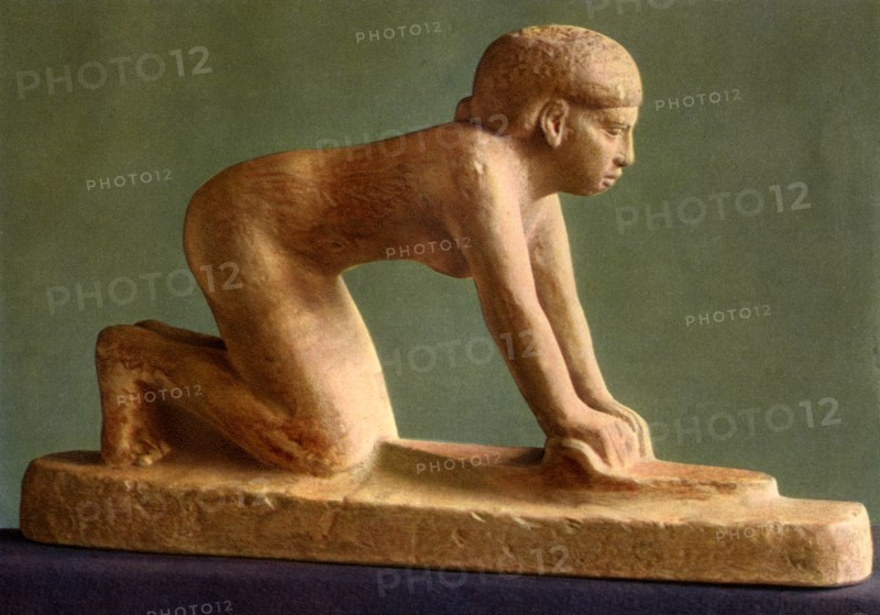 A woman grinding corn, c2650 BC (1936). Artist: Unknown