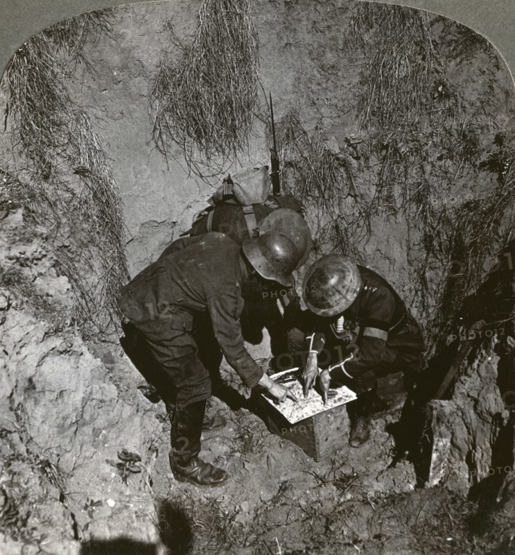 Captured German prisoner giving information to his captors, World War I, 1914-1918.Artist: Realistic Travels Publishers