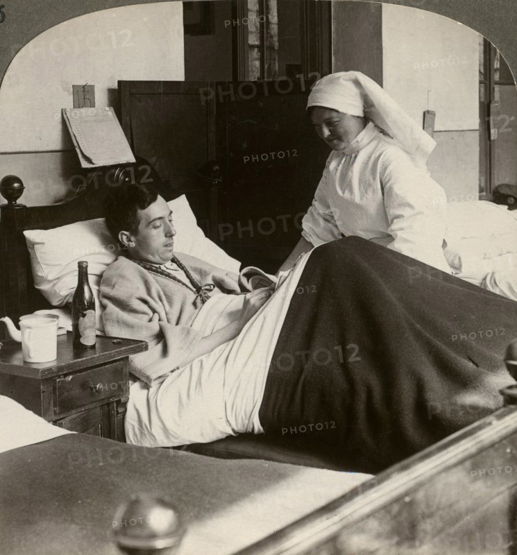 A soldier writing a letter in hospital, World War I, 1914-1918.Artist: Realistic Travels Publishers
