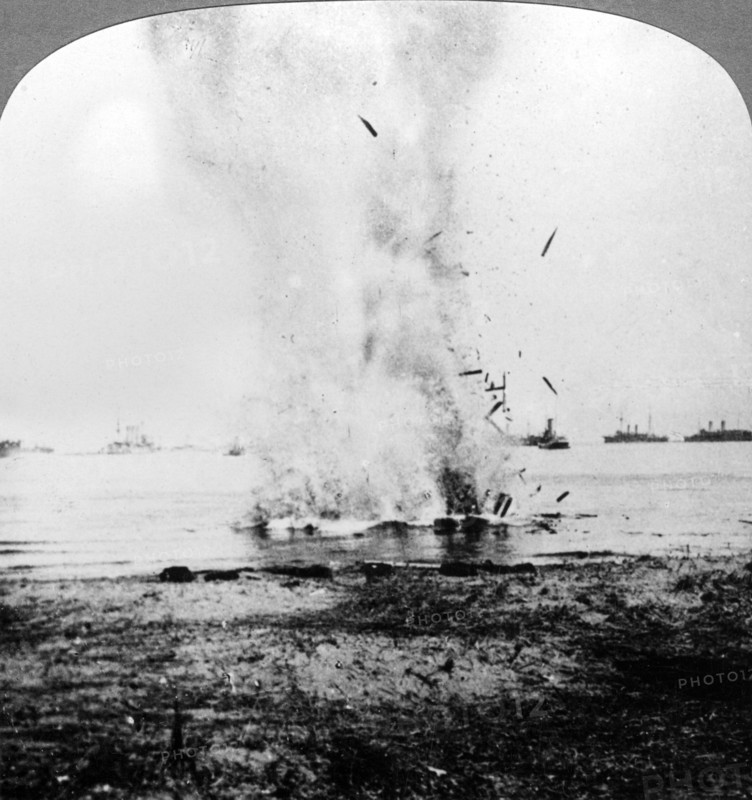 Trapped German submarine driven inshore and destroyed, World War I, 1914-1918Artist: Realistic Travels Publishers