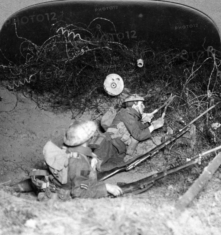 Soldiers cutting through barbed wire defences, Oppy, France, World War I, 1914-1918.Artist: Realistic Travels Publishers
