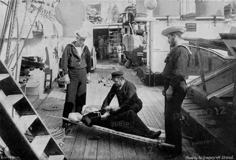 Ambulance drill on board the cruiser HMS 'Tartar', 1896.Artist: W Gregory