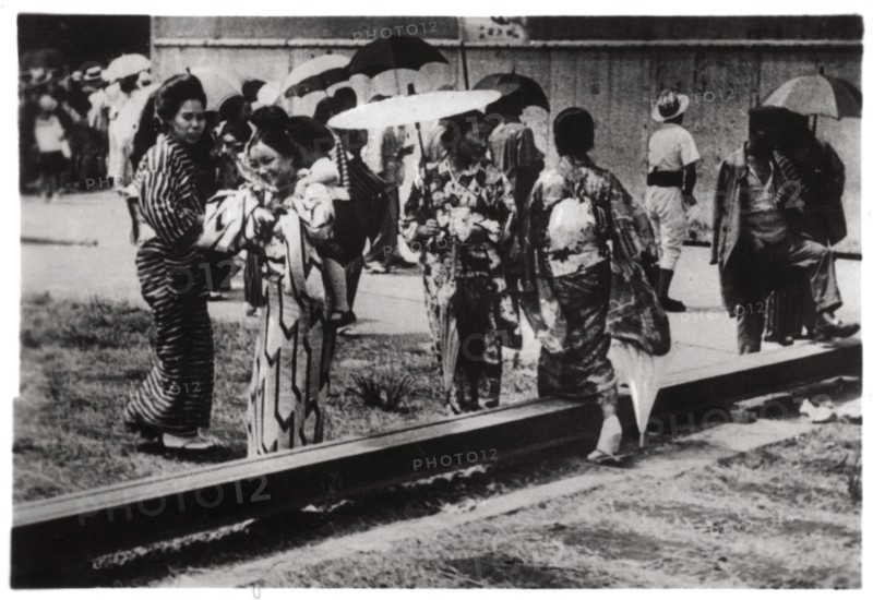 Japanese women by the Zeppelin hangar, Kasumigaura, Japan, 1929 (1933). Artist: Unknown