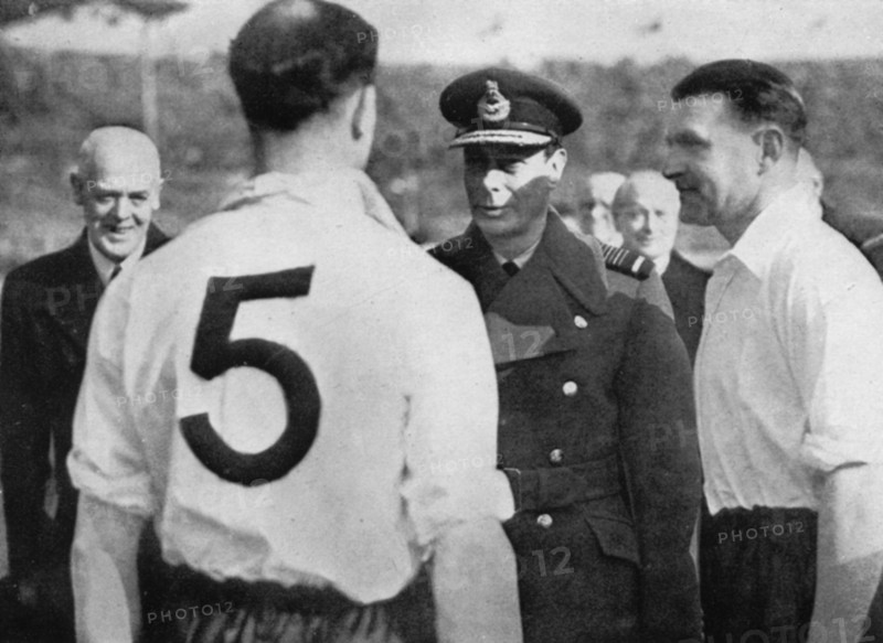 English footballer Eddie Hapgood meeting King George VI, c1937-c1944. Artist: Unknown