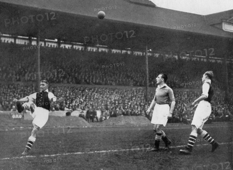 Acrobatics in a Arsenal v Chelsea match at Stamford Bridge, London, c1933-c1938. Artist: Sport & General