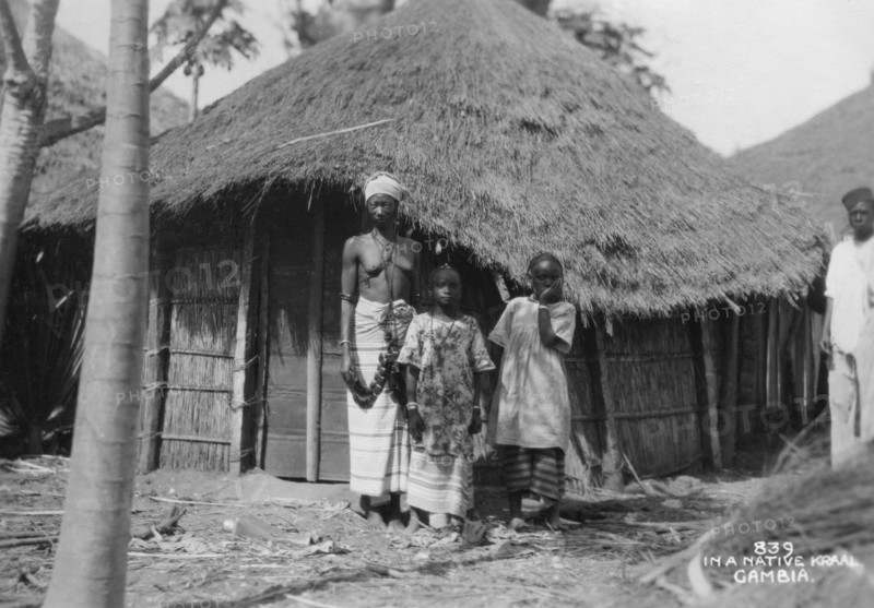 A family in front of their home, Gambia, 20th century. Artist: Unknown