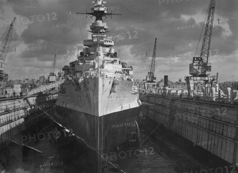 British battleship HMS 'Malaya' in a floating dock, Malta, c1937. Artist: Unknown