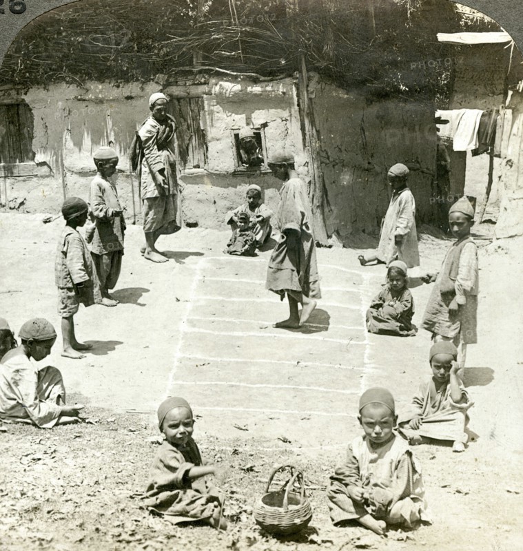 Children playing hopscotch, Kashmir, India, c1900s(?).Artist: Underwood & Underwood