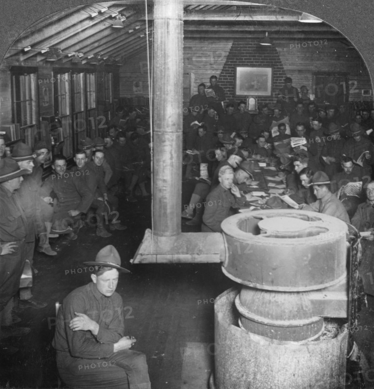 Social room of a YMCA army camp hut, early 20th century. Artist: Keystone View Company
