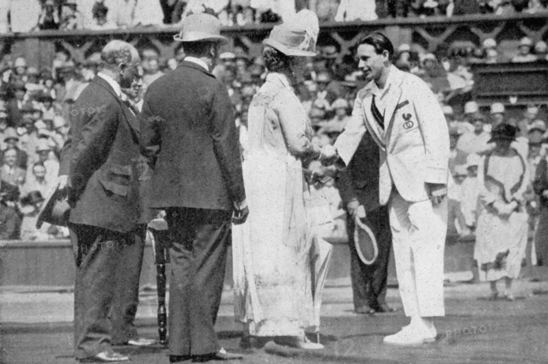 Jean Borotra receives his medal from Queen Mary on centre court, 1926. Creator: London News Agency Photos Ltd..