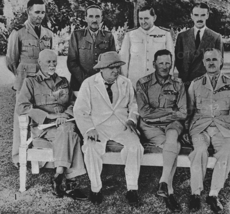 'At the Front in Egypt: Mr. Churchill in Cairo with members of the Middle East War Council', 1942. Artist: Unknown.