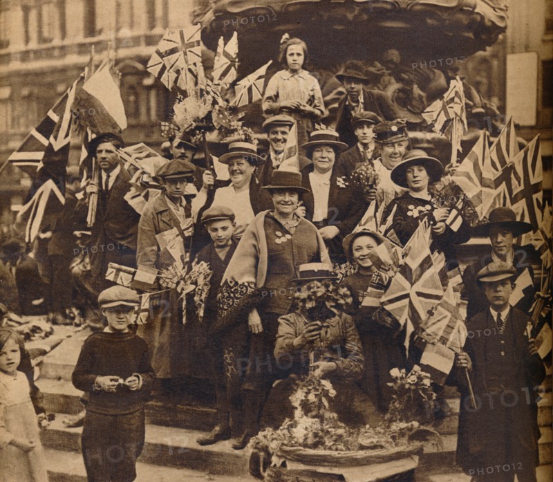 Victory celebrations underneath Eros, Piccadilly, London, 1918, (1938). Artist: Unknown.