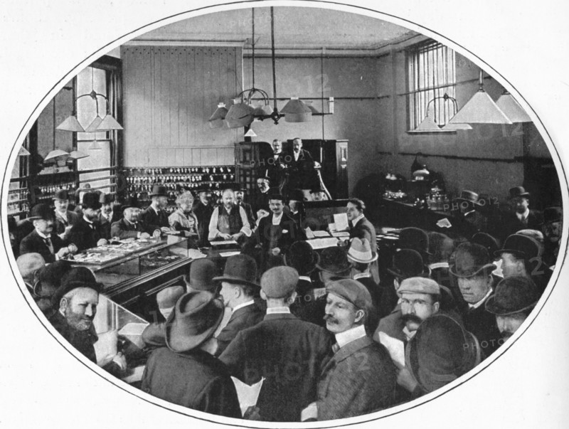 Sale of unredeemed goods at Debenham, Storr and Sons auction rooms, London, c1903 (1903). Artist: Unknown.