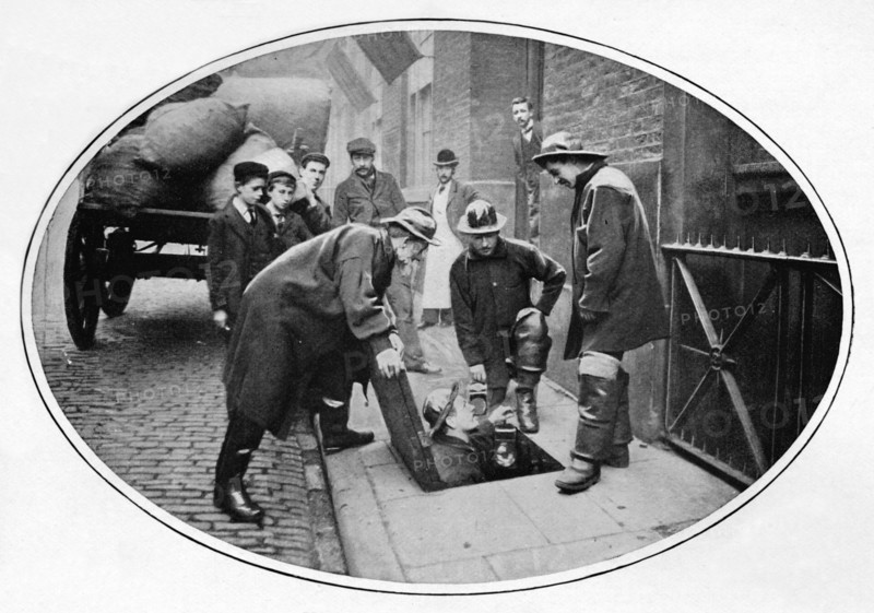 Sewermen going below, London, c1903 (1903). Artist: Unknown.
