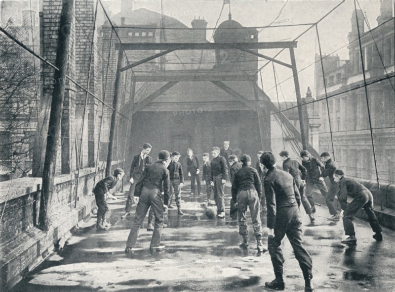 Boys playing football on the roof of St Paul's Cathedral Choir School, London, c1901 (1901). Artist: Unknown.