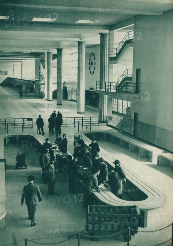 Customs officers examining passengers' baggage at Le Bourget Airport, Paris, 1937. Artist: Unknown.