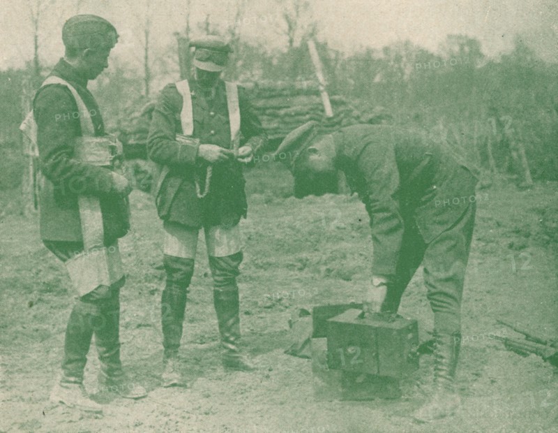 Aerial photographers fixing on parachute harnesses before making an ascent, c1917 (1919). Artist: Unknown.