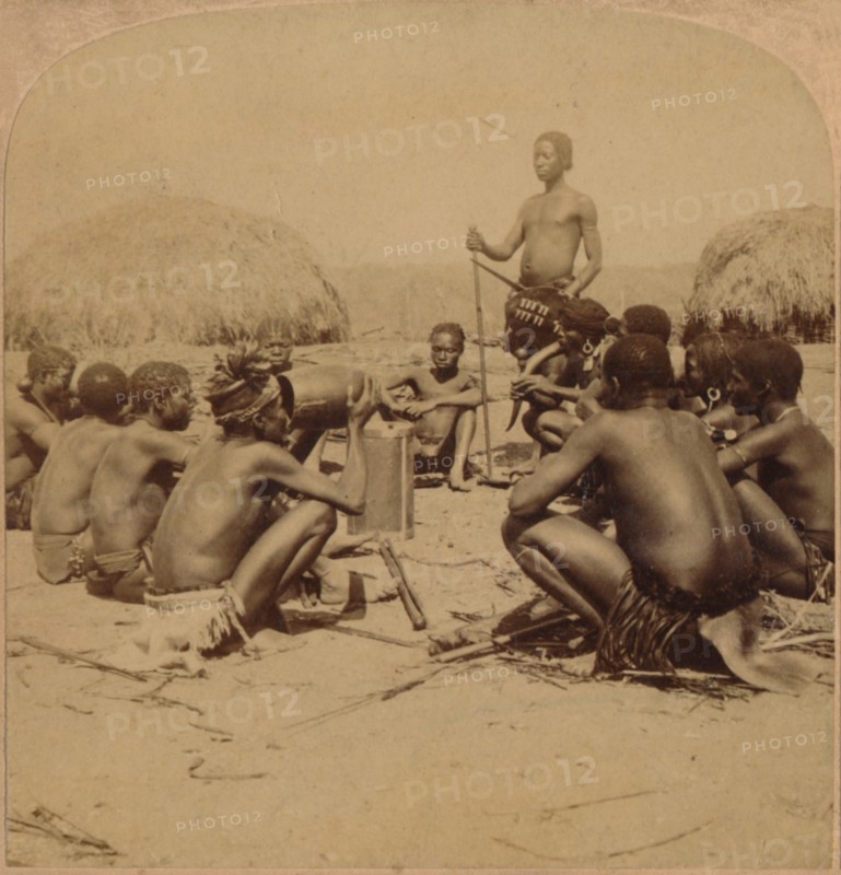 'Braves of a Zulu Village holding a Council, near the Umlaloose River, Zululand, S.A.', 1901. Artist: Unknown.