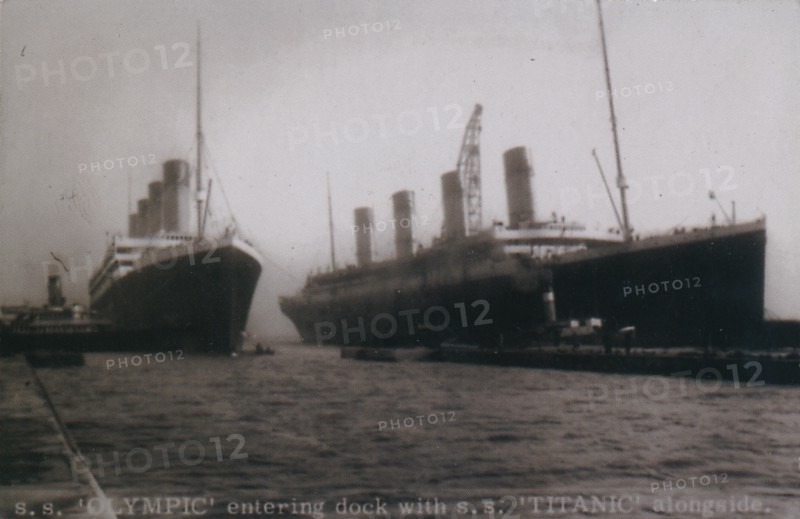 'S.S. 'Olympic' entering dock with S.S. 'Titanic' alongside', 1912. Artist: Unknown.