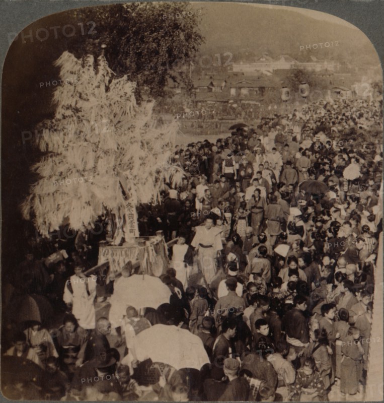 ''Shinto procession carrying sacred objects over bridge to Imperial Museum, Kyoto, Japan', 1904. Artist: Unknown.