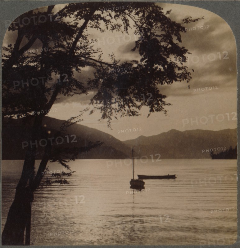 'Setting sun, over Lake Chuzenj, lying within its mountain walls, Japan', 1904.  Artist: Unknown.