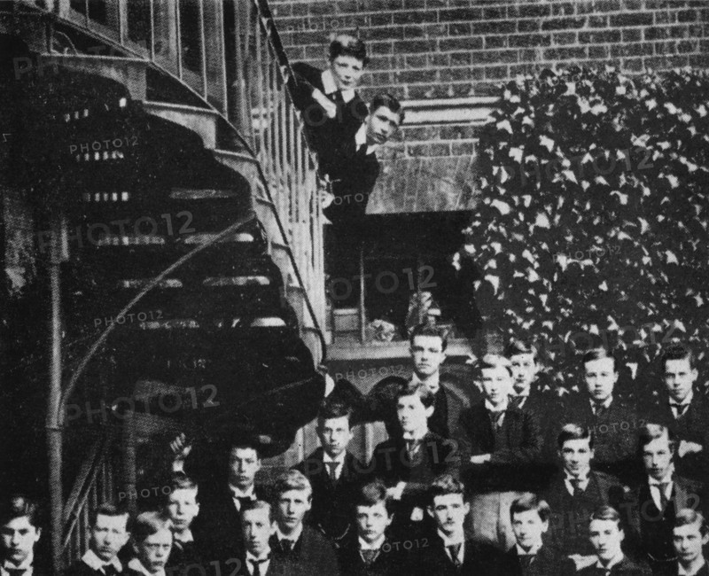 'Winston climbing a staircase, while the class pose', c1889, (1945). Artist: Unknown.