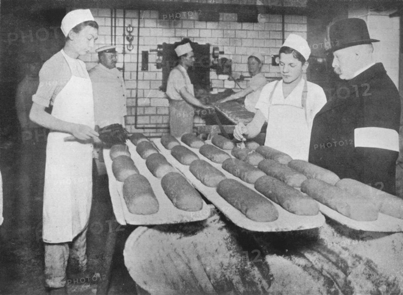 'An inspector visiting a Berlin bakery', 1915.  Artist: Unknown.