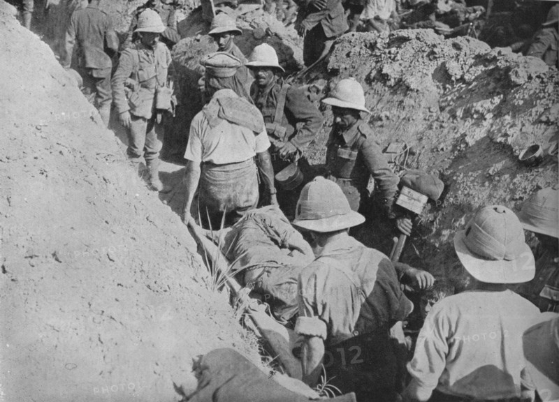 'Carrying wounded through the trenches', 1915. Artist: Unknown.