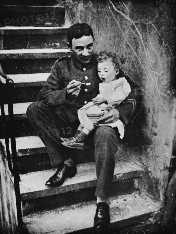 'One of the New Army making himself useful in his billet', 1915. Artist: Unknown.