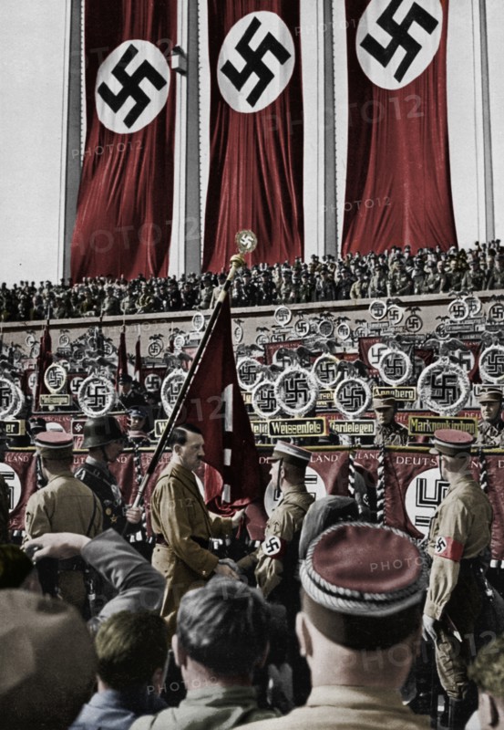 Adolf Hitler dedicates new standards, Nuremberg Rally, Germany, 1934.  Artist: Unknown.