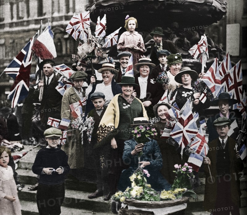 Victory celebrations underneath Eros, Piccadilly, London, 1918, (1938). Artist: Unknown.