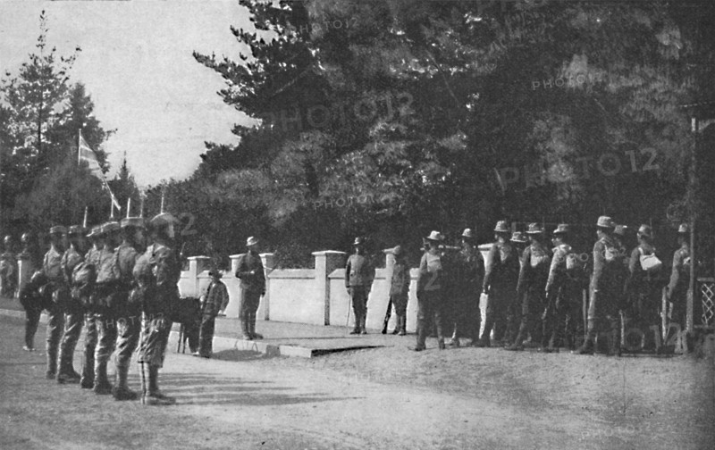 'Grenadier Guards (with their new hats) relieving guard at Lord Roberts's headquarters, Pretoria', 1 Artist: Unknown.