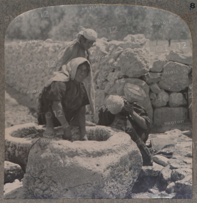 'Women drawing water at the Fountain of the Magi, on the road to Bethlehem', c1900. Artist: Unknown.