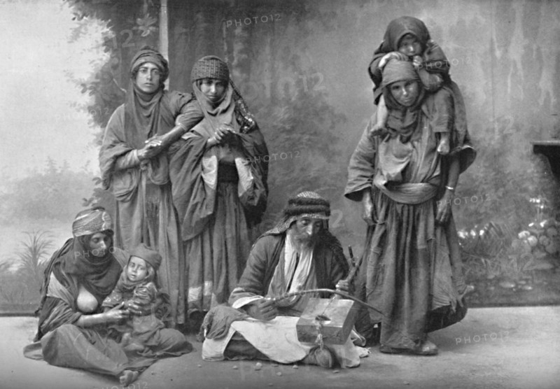 A Bedouin musician and his audience, 1902. Artist: Unknown.