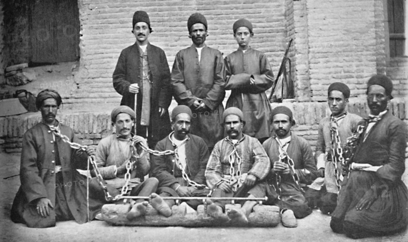 Prisoners and gaolers in a prison yard, Nahavand, Persia, 1902. Artist: Unknown.