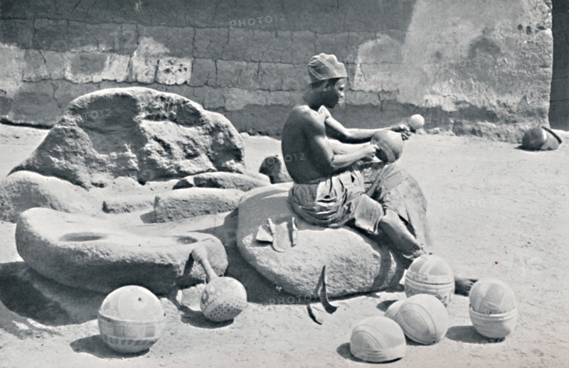 A Yoruba man engraving clay bowls and water jars, Lagos hinterland, Southern Nigeria, 1912. Artist: AW Gelston.