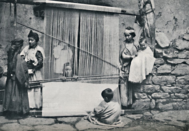 Kabyle weavers and native loom, Northern Algeria, 1912. Artist: Legrand.