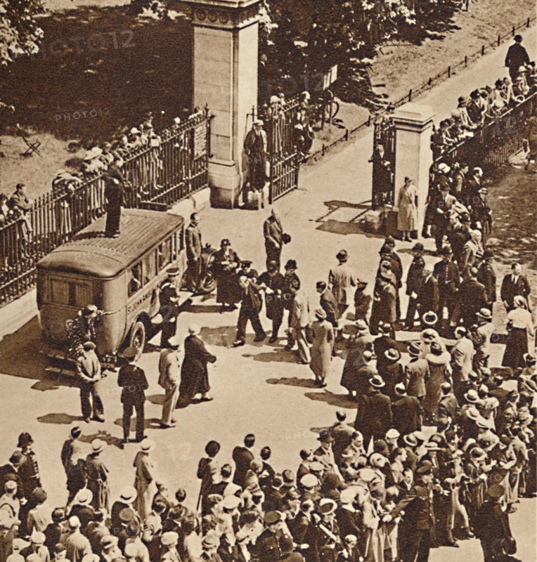 'Crowd watches the arrested man taken to police van', 1937. Creator: Unknown.