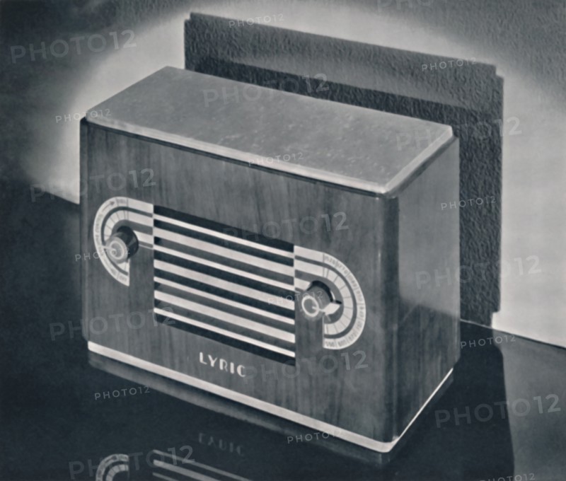 'A midget radio cabinet in wood veneer, with aluminum grill and dials', 1935. Artist: Dana Merrill.