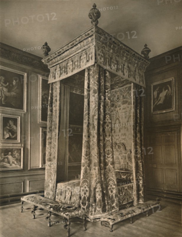 'Queen Anne's State Bedstead in Crimson and Gold Figured Velvet', 1927. Artists: Edward F Strange, Unknown.