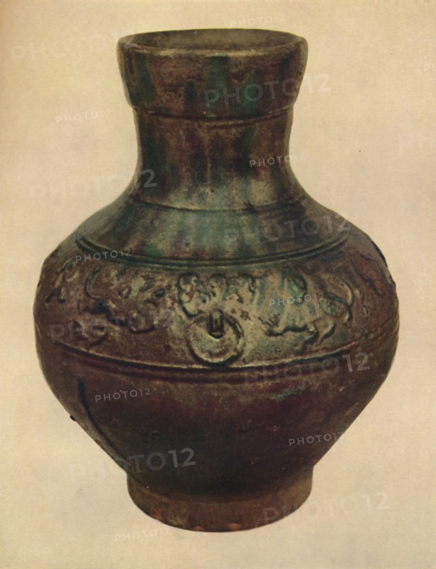 'Wine Jar with Hunting Scene in Relief. Han Dynasty, 206 BC - AD 221, (1927). Artists: Edward F Strange, Unknown.