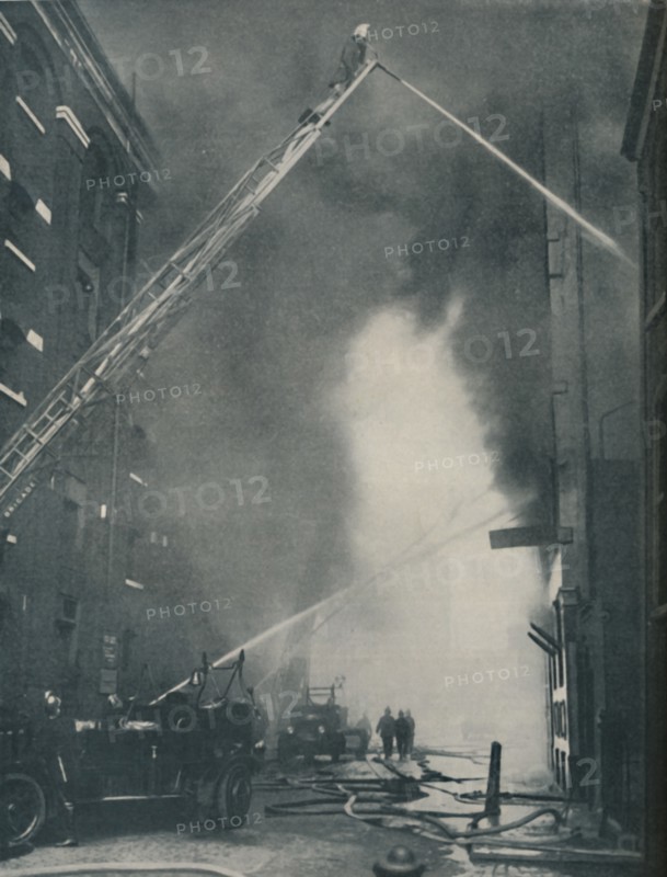 'Massed Forces of the Modern Fire-Fighter Pitted Against a City Blaze', c1935. Artist: Unknown.