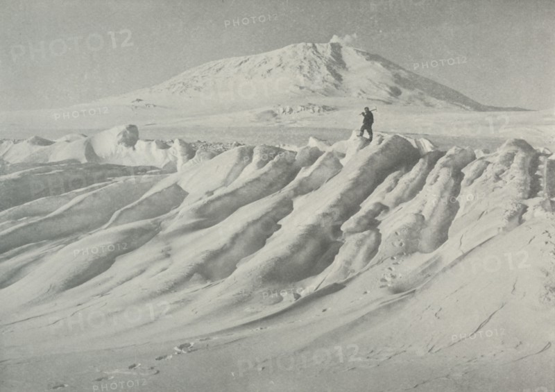 'Mount Erebus Over a Water-Worn Iceberg', October 1911, (1913). Artist: Herbert Ponting.