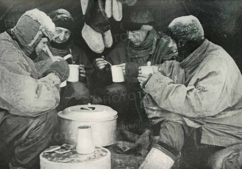 'Members of the Polar Party Having A Meal in Camp', c1911, (1913). Artist: Unknown.