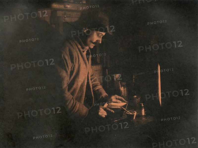 'Ponting Developing a Plate in the Dark Room', c1910?1913, (1913).  Artist: Unknown.