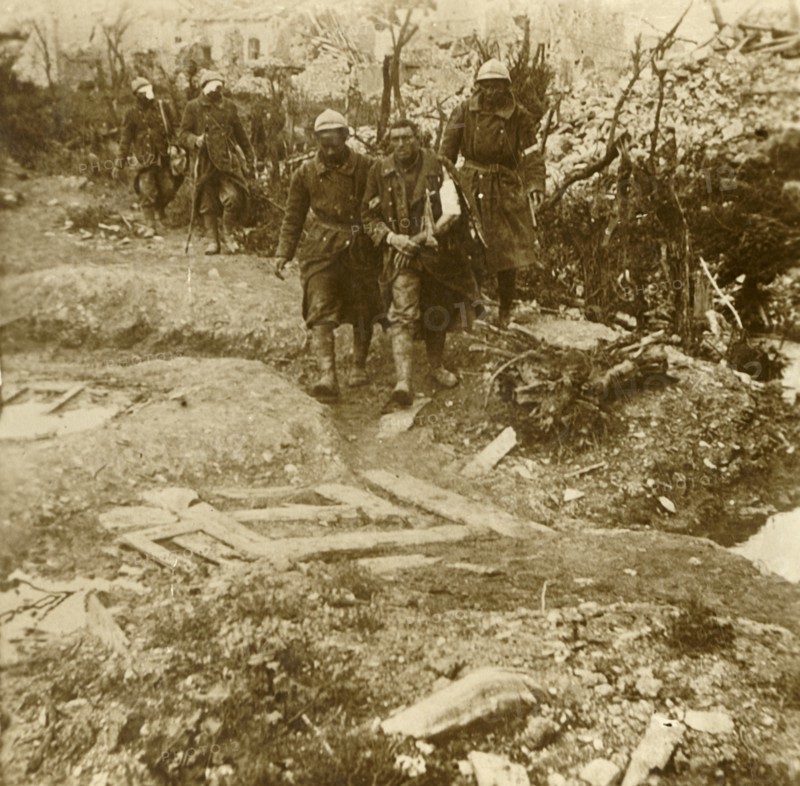 Wounded French infantrymen arriving at Chateau d'Esnes, Verdun, northern France, 1916. Artist: Unknown.
