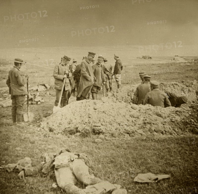 Burying bodies, Sainte-Marie-à-Py, northern France, c1914-c1918.  Artist: Unknown.